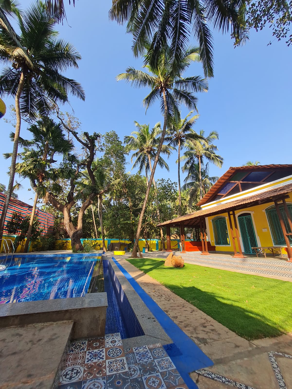 Pool, lawn and office view from the small gate side at Valentine Villa