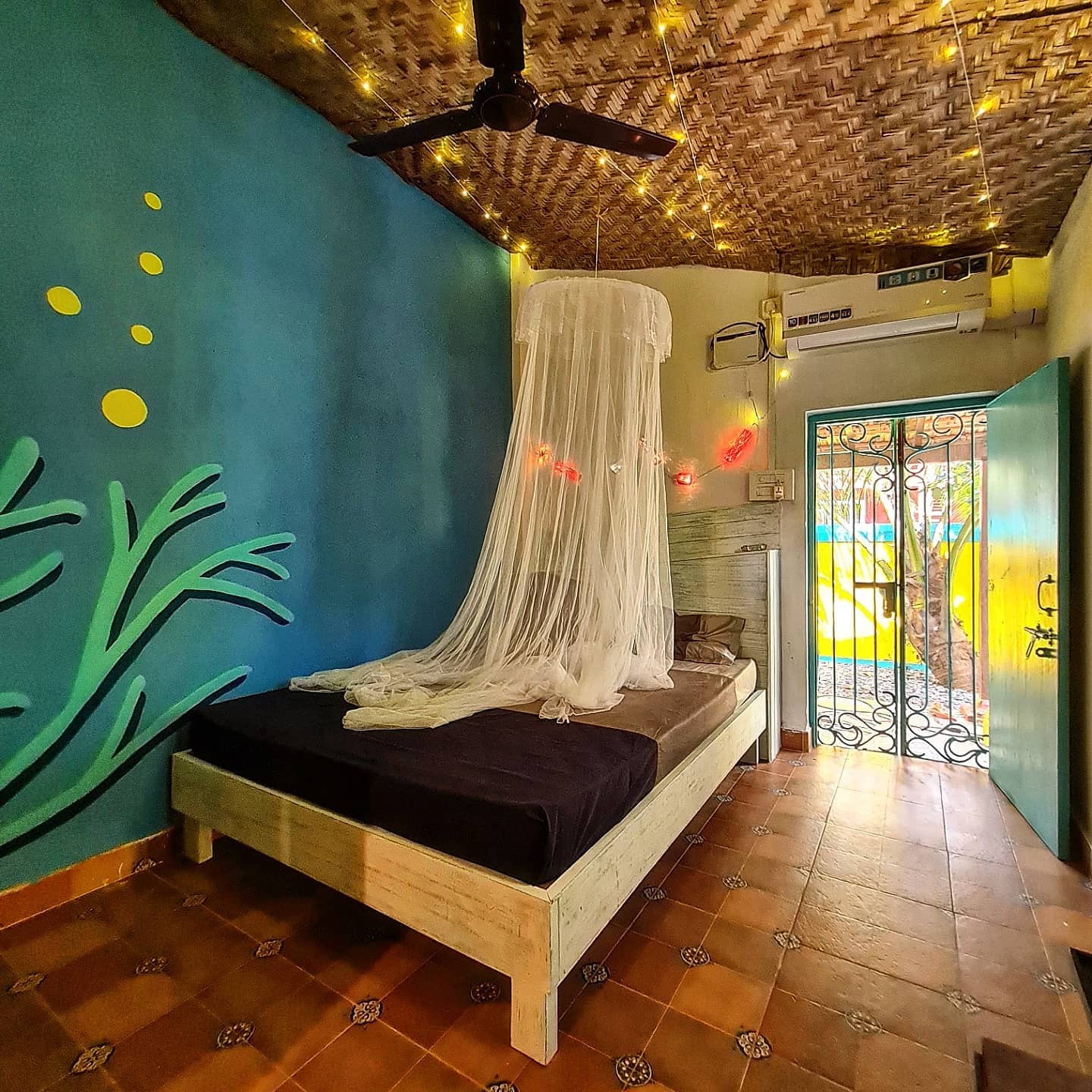 Soppo Room bed view — comfortable double bed, warm lighting, cosy atmosphere