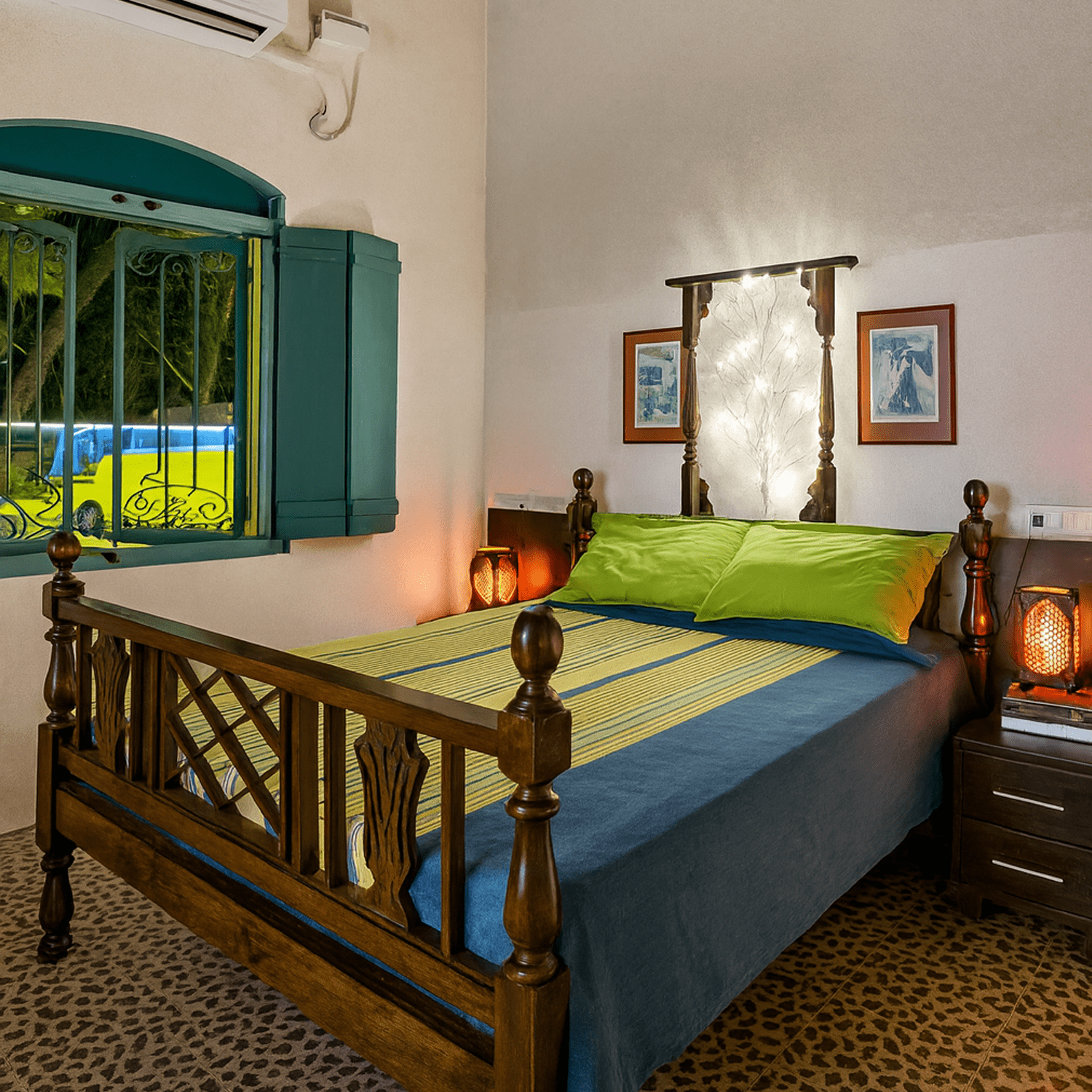 Nana's Room at Valentine Villa - a spacious heritage bedroom with high ceilings, original Portuguese details, a comfortable sitting area, and modern amenities for a luxurious family stay in Goa.